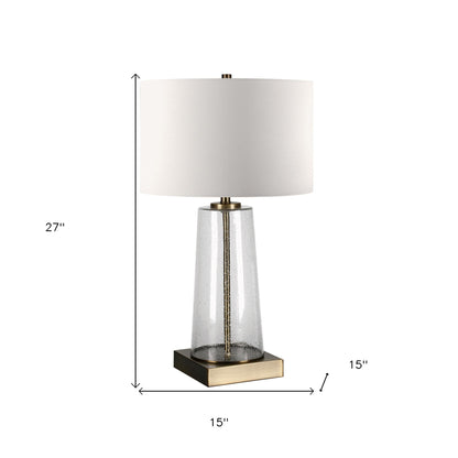 27" Brass and Clear Metal and Glass Table Lamp With White Drum Shade