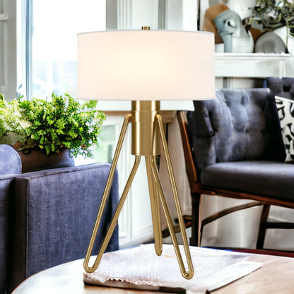 25" Brass Metal Two Light Tripod Table Lamp With White Drum Shade