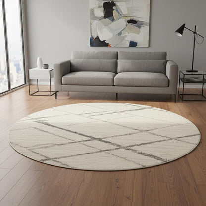 8' Beige and Gray Abstract Distressed Round Rug