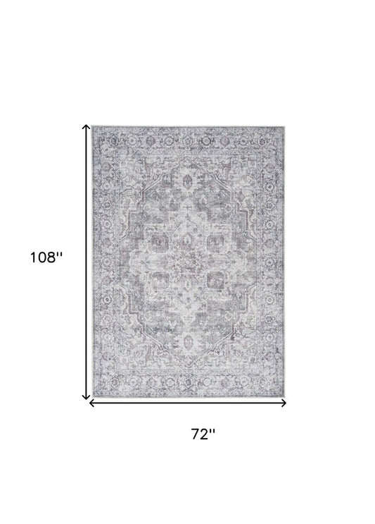 6' X 9' Blue And Pink Floral Power Loom Distressed Washable Area Rug