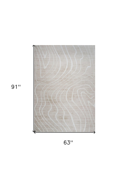 5' X 8' Beige and Ivory Abstract Distressed Area Rug