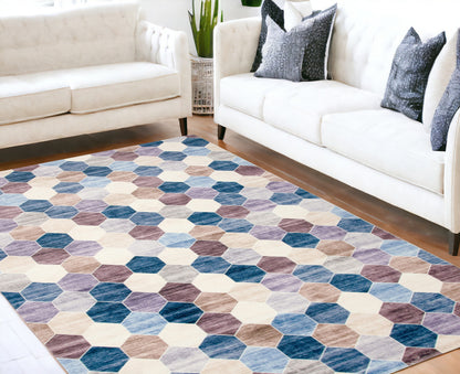 5' X 8' Ivory and Blue Geometric Distressed Area Rug