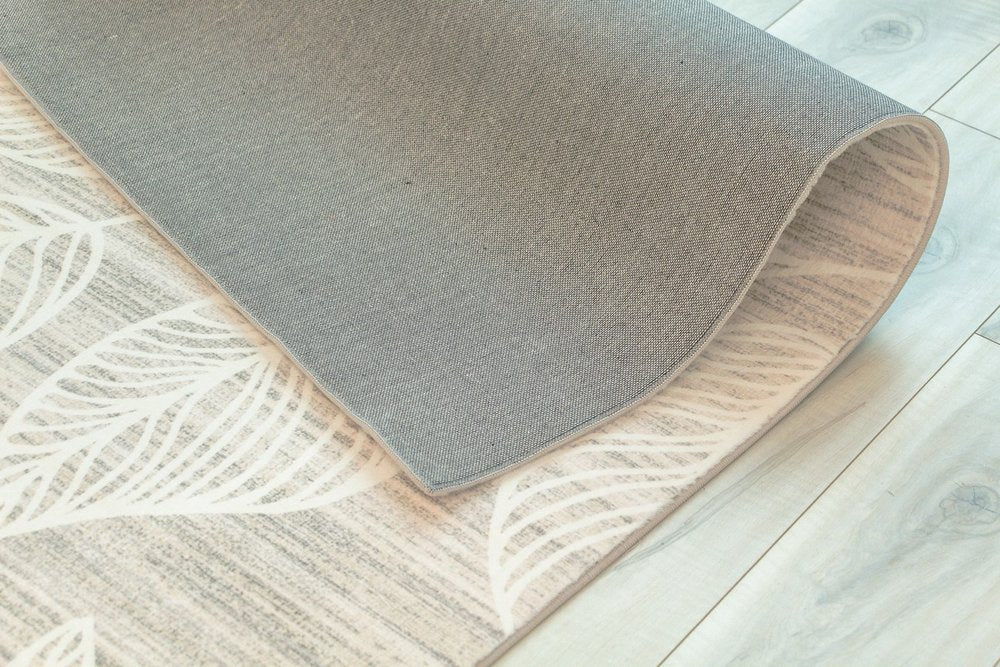 7' X 10' Beige and Ivory Floral Distressed Area Rug