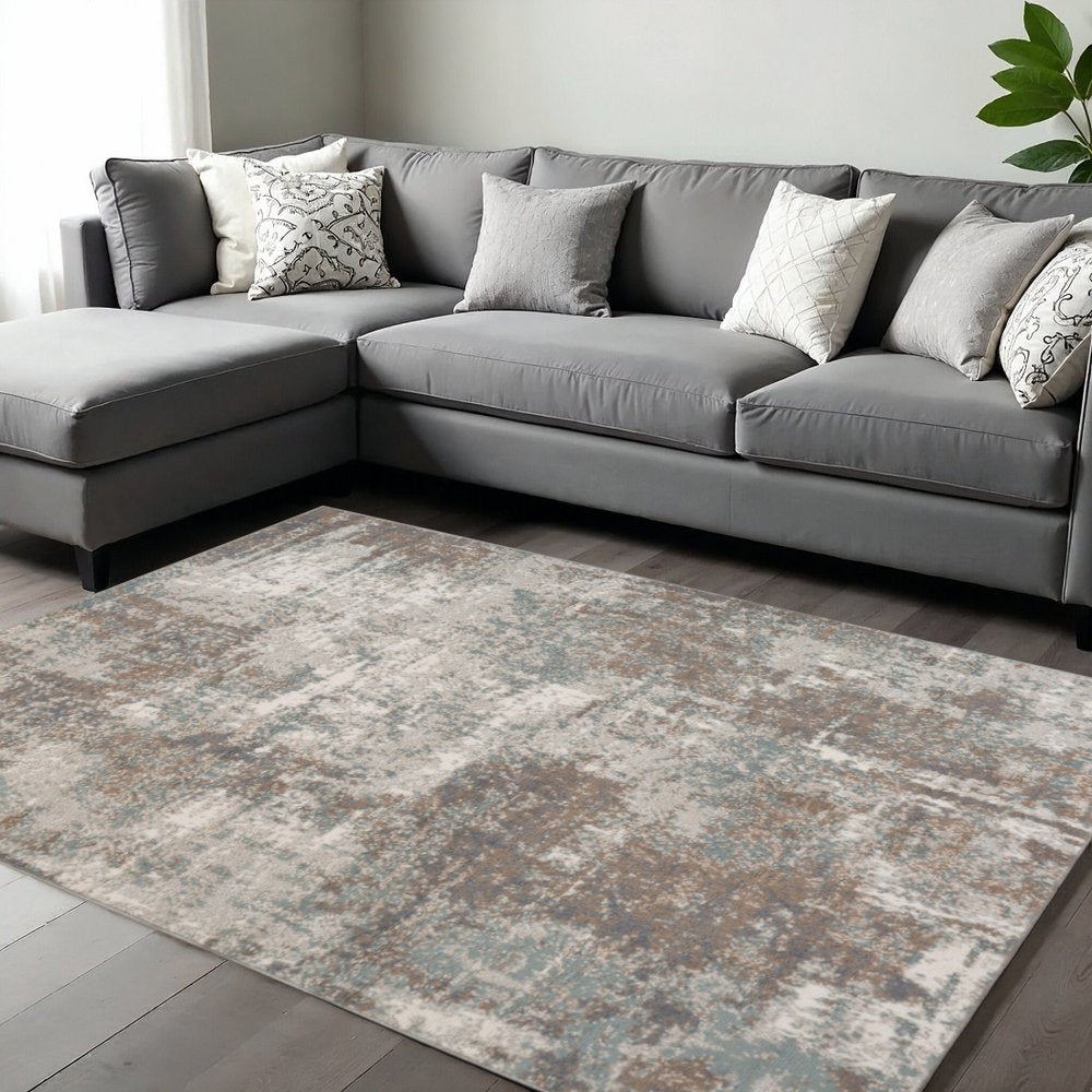 6' X 9' Ivory Brown And Green Abstract Area Rug