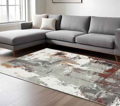 2' X 3' Ivory Gray and Rust Abstract Power Loom Area Rug