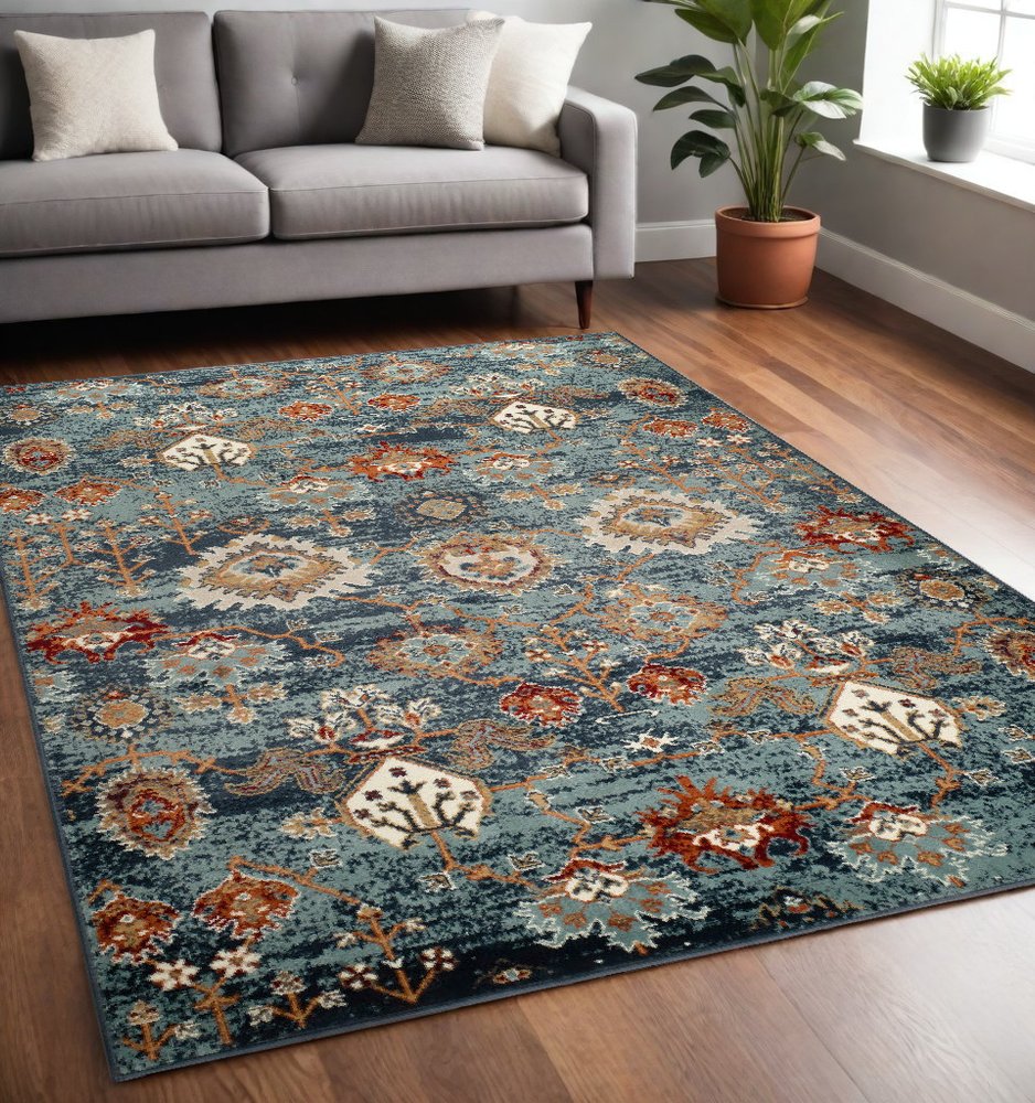 5' X 8' Ivory Rust And Teal Oriental Area Rug