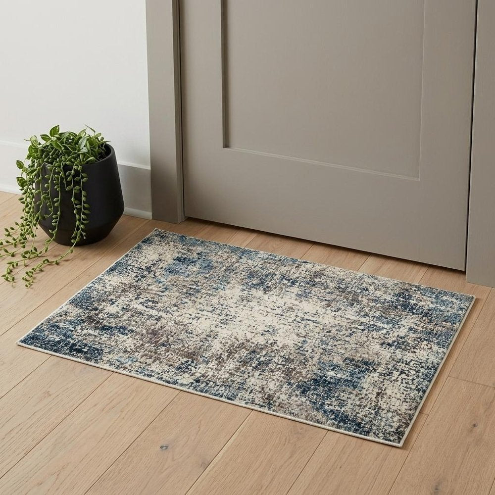 5' X 8' Ivory Blue and Gray Abstract Power Loom Area Rug