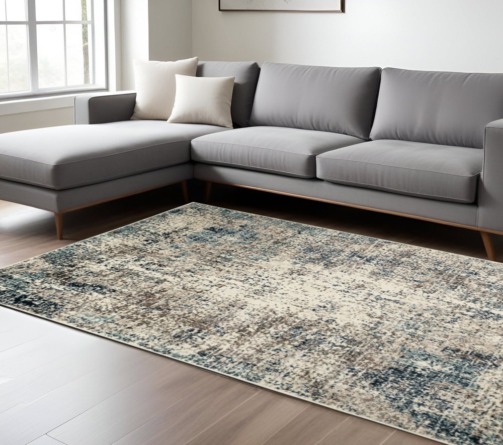 5' X 8' Ivory Blue and Gray Abstract Power Loom Area Rug