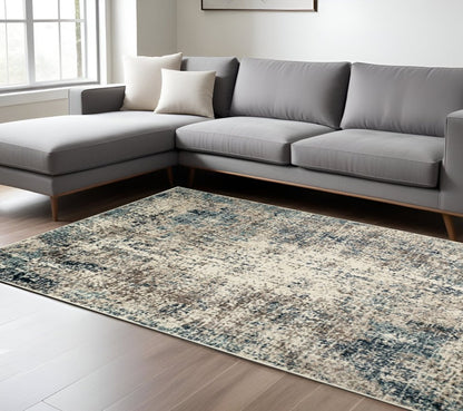 5' X 8' Ivory Blue and Gray Abstract Power Loom Area Rug