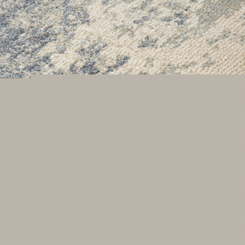 6' X 9' Light Gray Blue And Ivory Abstract Area Rug