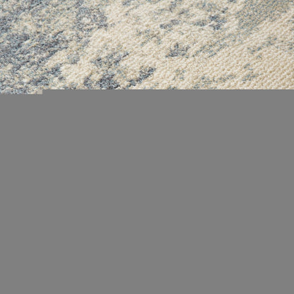 6' X 9' Light Gray Blue And Ivory Abstract Area Rug