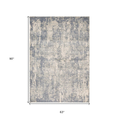 6' X 9' Light Gray Blue And Ivory Abstract Area Rug