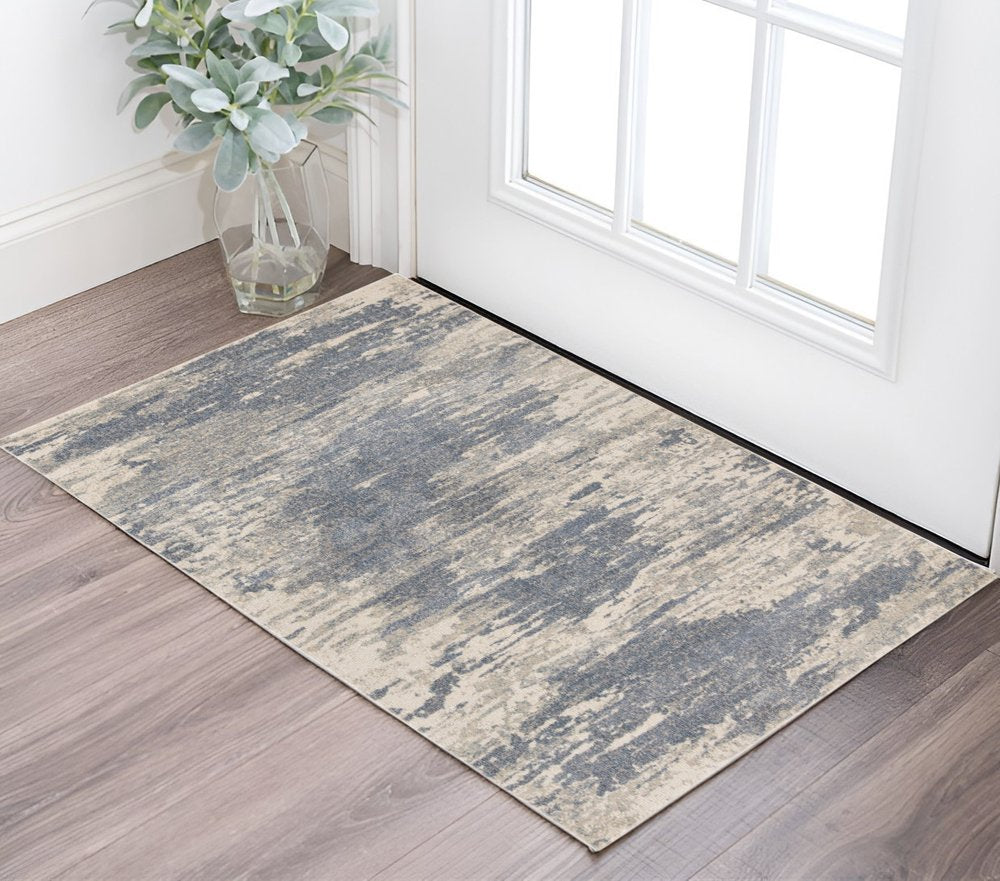 8' X 10' Ivory Blue And Gray Abstract Area Rug