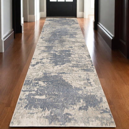2' X 3' Ivory Blue And Gray Abstract Area Rug