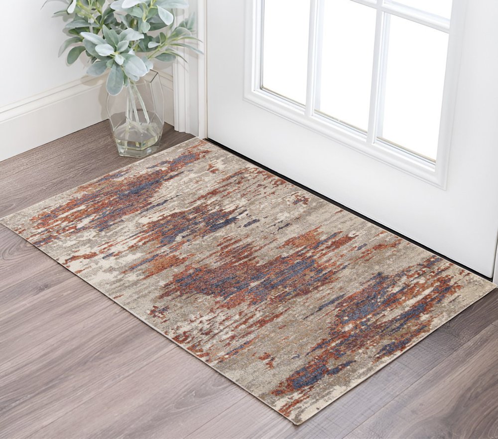 8' X 10' Beige Rust And Blue Abstract Area Rug