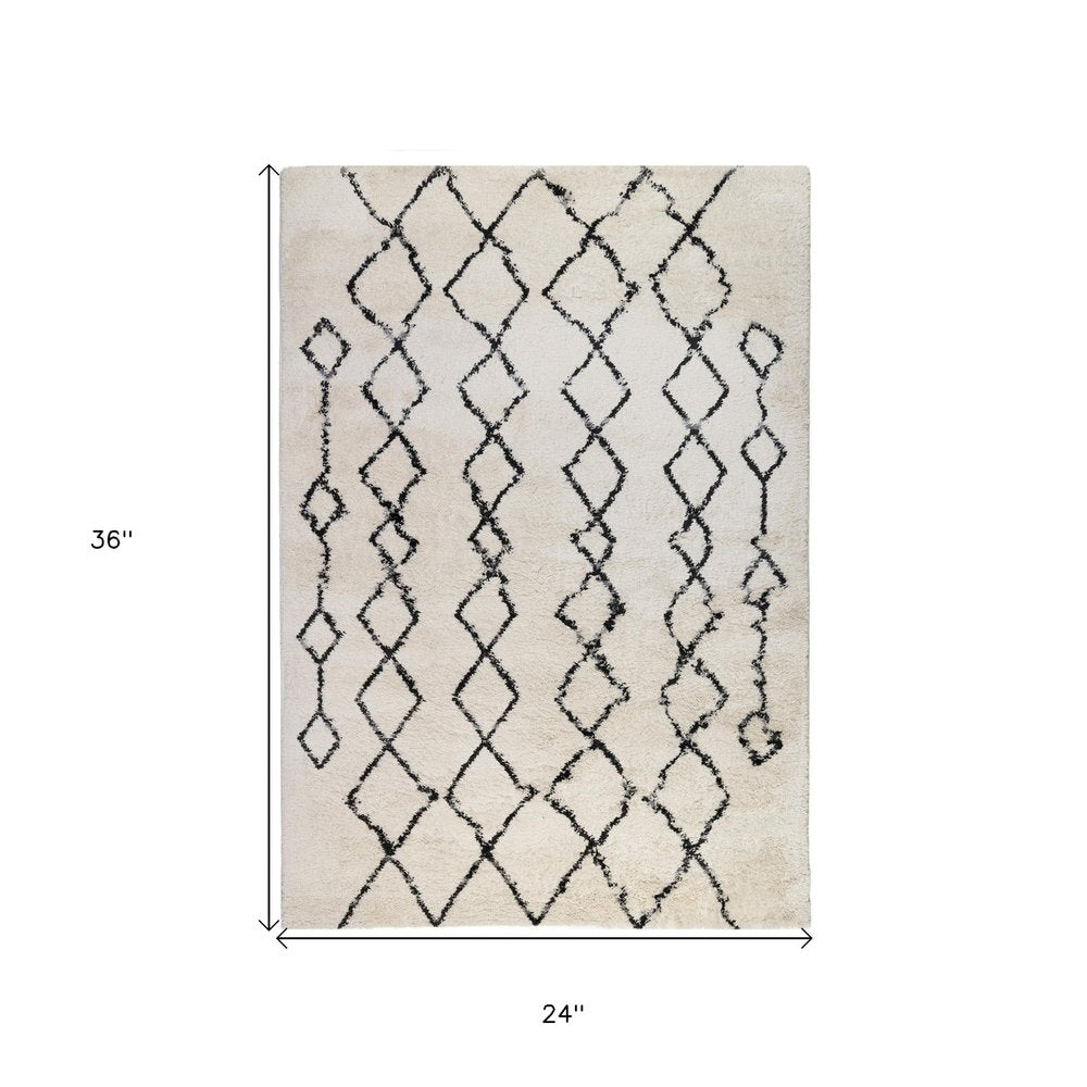 2' X 3' Ivory And Black Geometric Shag Area Rug
