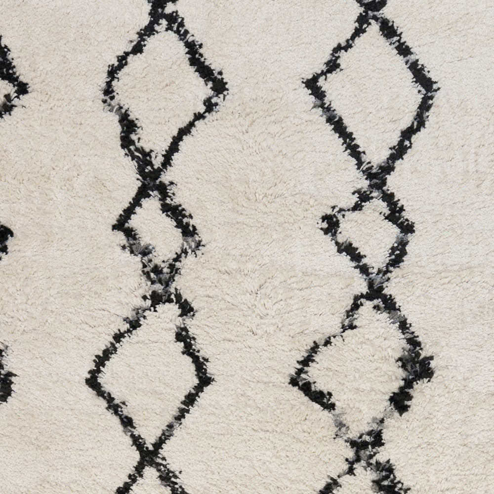 5' X 8' Ivory And Black Geometric Shag Area Rug