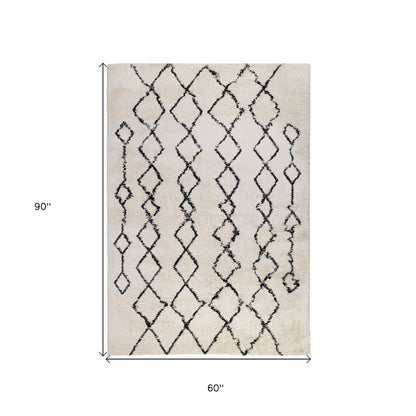 2' X 3' Ivory And Black Geometric Shag Area Rug