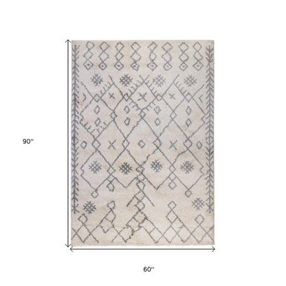 5' X 8' Gray And Ivory Geometric Shag Area Rug