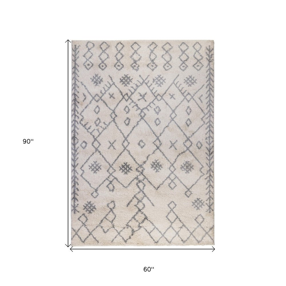 5' X 8' Gray And Ivory Geometric Shag Area Rug