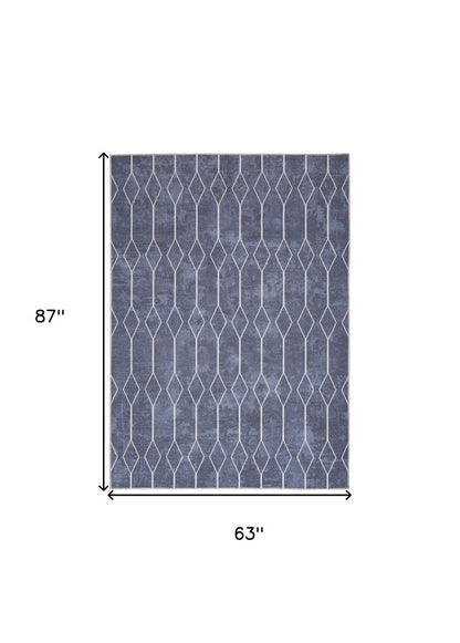 5' X 7' Blue and Ivory Geometric Power Loom Washable Area Rug