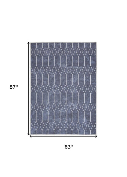 5' X 7' Blue and Ivory Geometric Power Loom Washable Area Rug
