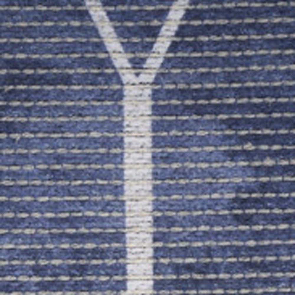 5' X 7' Blue and Ivory Geometric Power Loom Washable Area Rug
