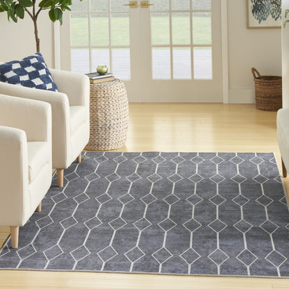 5' X 7' Blue and Ivory Geometric Power Loom Washable Area Rug