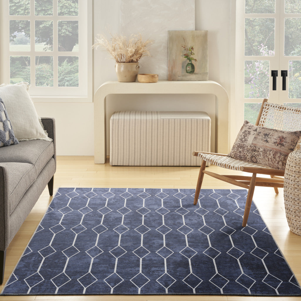 5' X 7' Blue and Ivory Geometric Power Loom Washable Area Rug