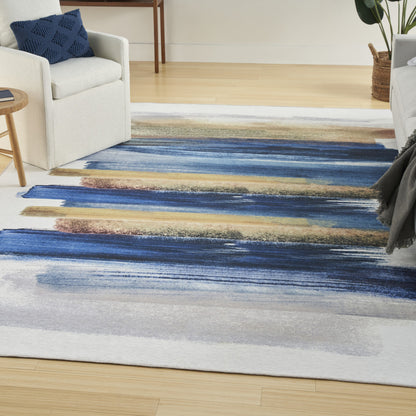 5' X 7' Ivory and Blue Abstract Power Loom Washable Non Skid Area Rug