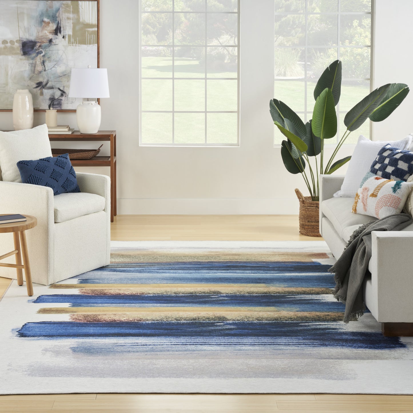 5' X 7' Ivory and Blue Abstract Power Loom Washable Non Skid Area Rug