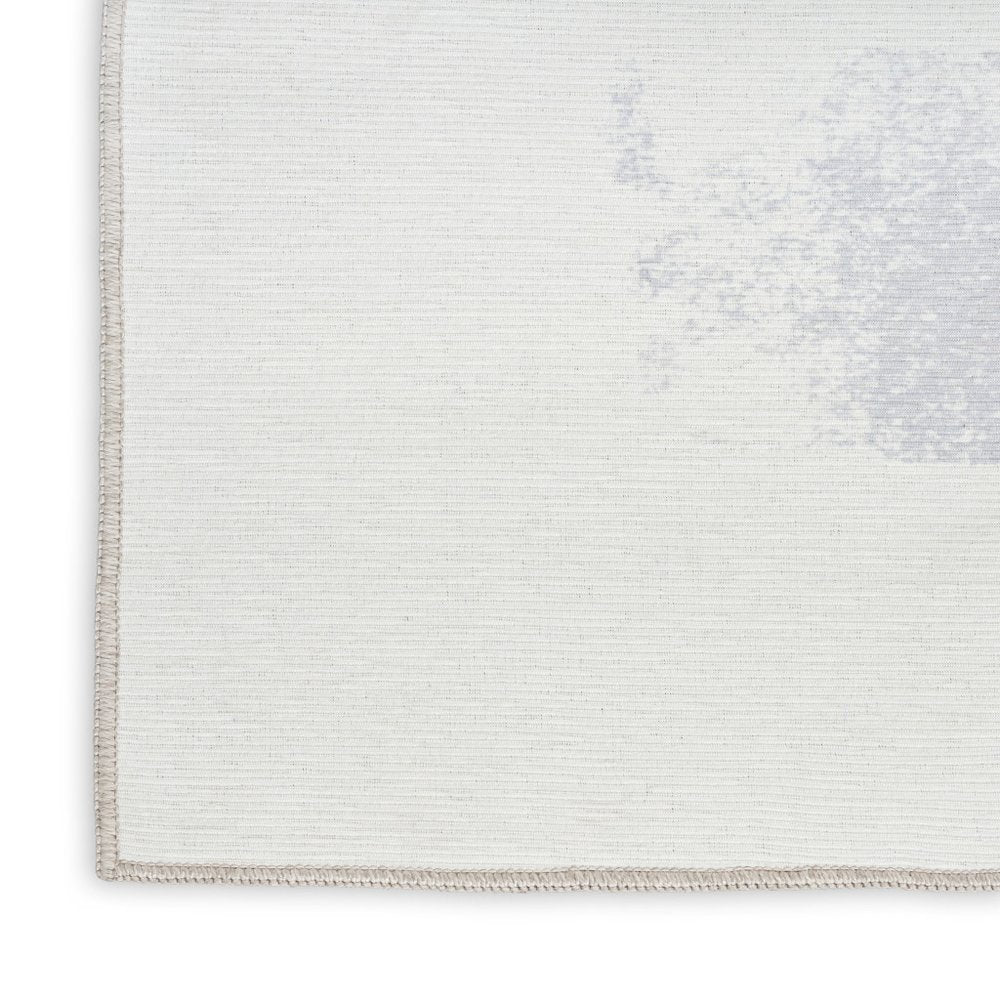 8' X 10' Ivory and Blue Abstract Power Loom Washable Non Skid Area Rug
