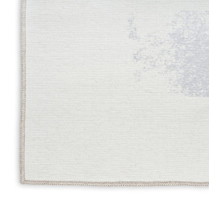 8' X 10' Ivory and Blue Abstract Power Loom Washable Non Skid Area Rug