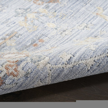 3' X 5' Blue and Ivory Oriental Power Loom Distressed Area Rug With Fringe