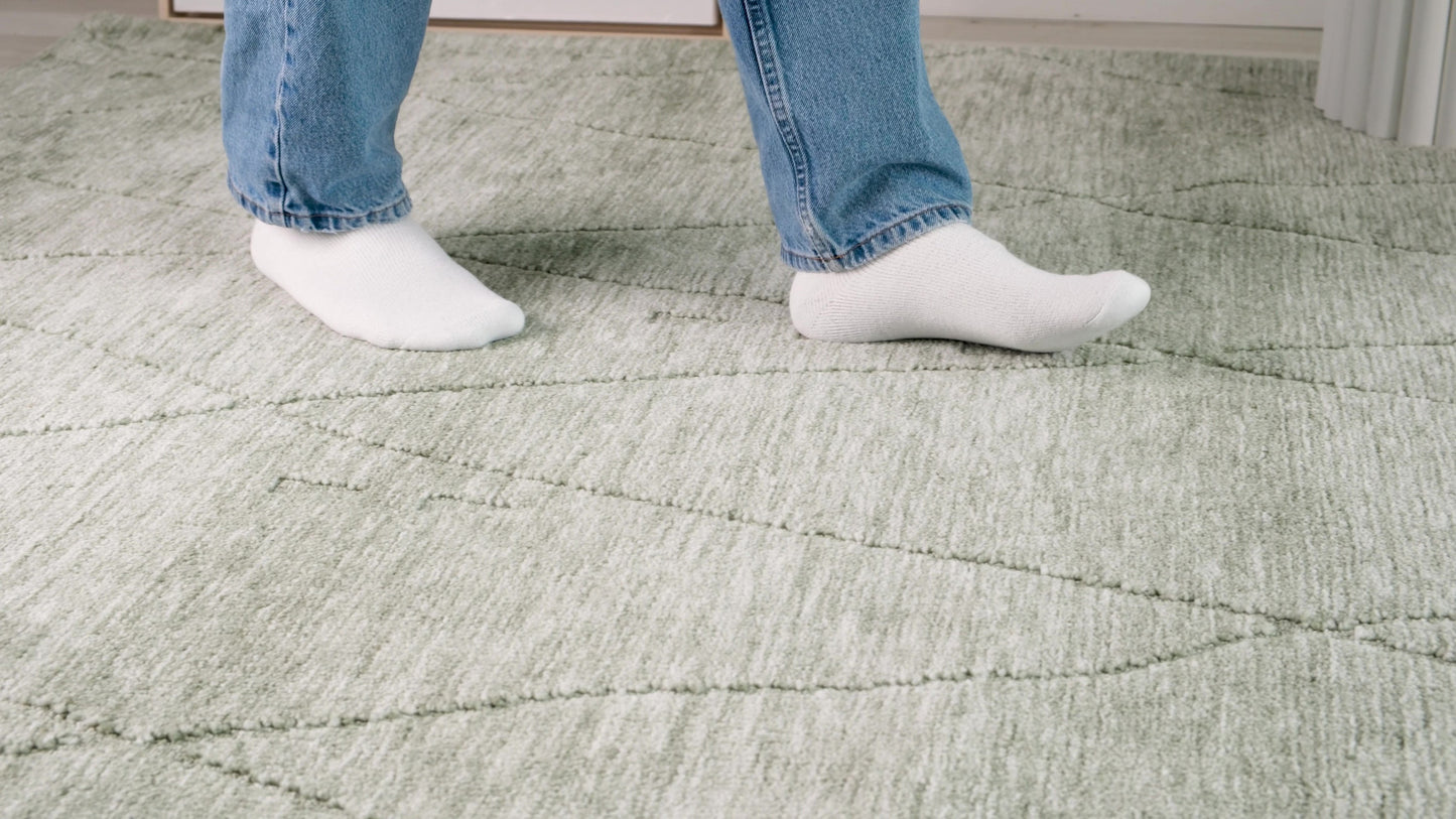 7' X 10' Green and Ivory Geometric Power Loom Distressed Area Rug