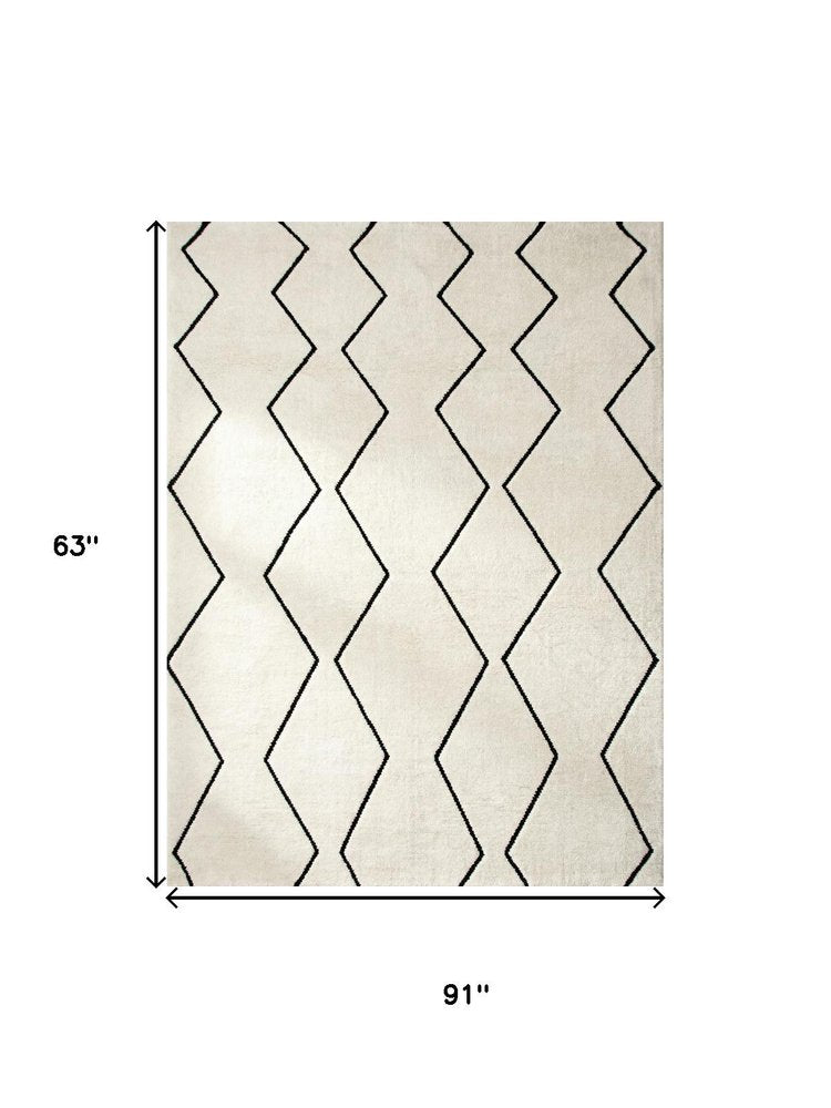 5' X 8' Beige and Black Geometric Power Loom Distressed Non Skid Area Rug
