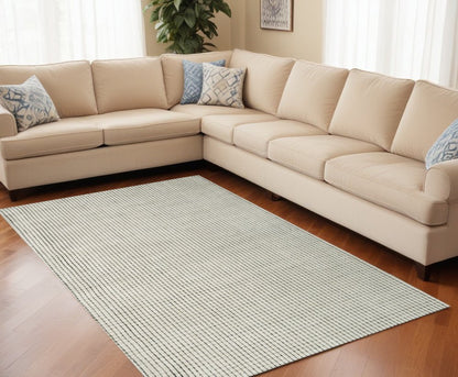 5' X 8' Beige and Black Checkered Power Loom Distressed Area Rug