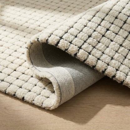 5' X 8' Beige and Black Checkered Power Loom Distressed Area Rug