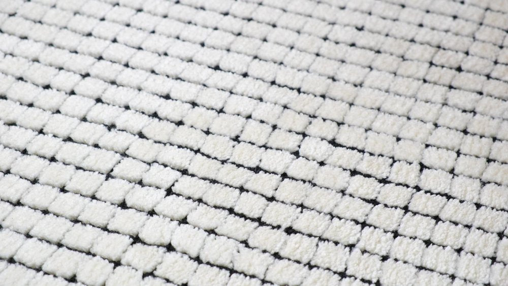 5' X 8' Beige and Black Checkered Power Loom Distressed Area Rug