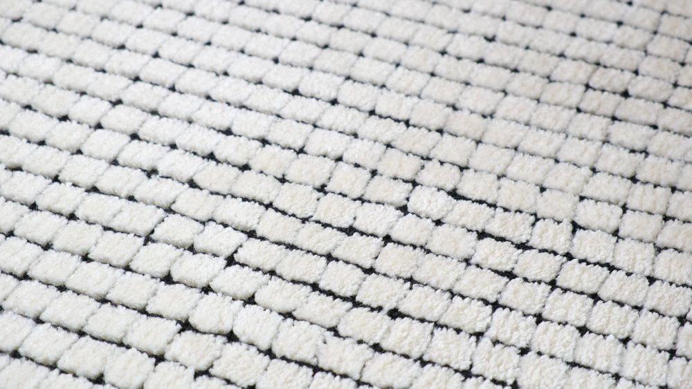 5' X 8' Beige and Black Checkered Power Loom Distressed Area Rug