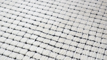 5' X 8' Beige and Black Checkered Power Loom Distressed Area Rug