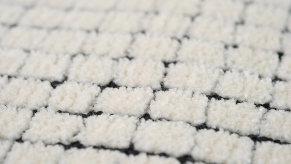5' X 8' Beige and Black Checkered Power Loom Distressed Area Rug