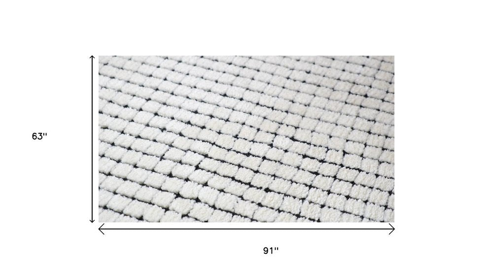 5' X 8' Beige and Black Checkered Power Loom Distressed Area Rug
