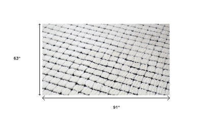 5' X 8' Beige and Black Checkered Power Loom Distressed Area Rug