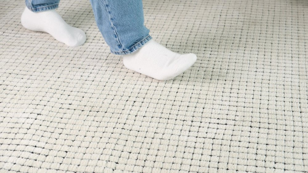 5' X 8' Beige and Black Checkered Power Loom Distressed Area Rug