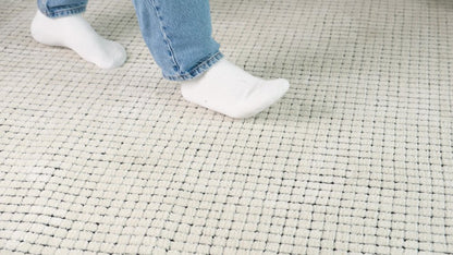 5' X 8' Beige and Black Checkered Power Loom Distressed Area Rug