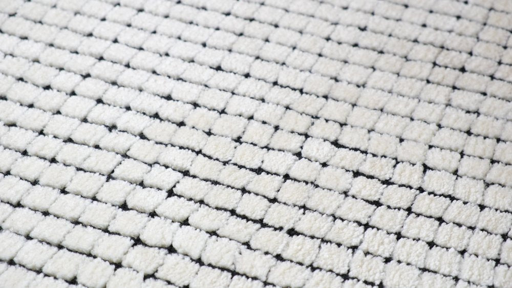 5' X 8' Beige and Black Checkered Power Loom Distressed Area Rug