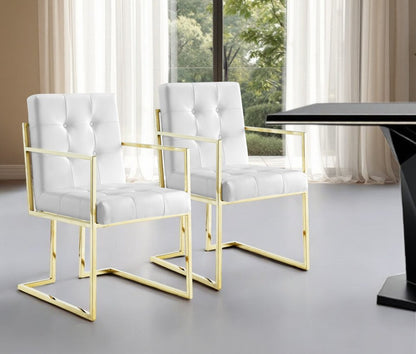 Set of Two Tufted White and Gold Upholstered Faux Leather Dining Arm Chairs