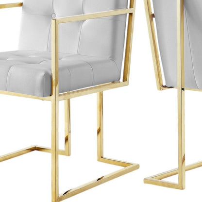 Set of Two Tufted White and Gold Upholstered Faux Leather Dining Arm Chairs