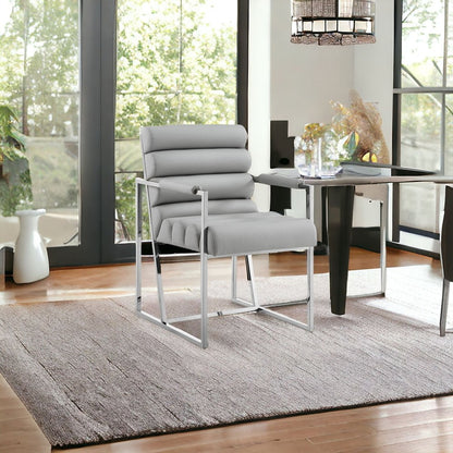 Set of Two Tufted Black And Gold Upholstered Faux Leather Dining Arm Chairs